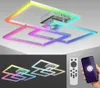 A modern ceiling light with geometric square shapes, illuminated with various colors, shown with a remote and smartphone. Produktbild-Vorschau
