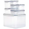 A set of clear plastic food storage containers with blue lids, stacked on a white background. Produktbild-Vorschau
