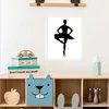 A framed picture of a ballerina is displayed on a wall above a shelf filled with children's toys and storage boxes. Anteprima dell’immagine prodotto