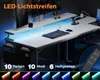 A gaming desk with LED lighting and accessories. Produktbild-Vorschau