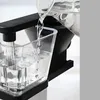 Water being poured into a coffee maker's water reservoir. Produktbild-Vorschau