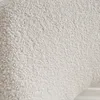 A close-up view of a white bouclé fabric texture. Anteprima dell’immagine prodotto