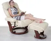 A woman is sitting in a recliner chair with an ottoman, reading a book. Náhled obrázku produktu
