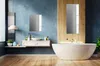 A modern bathroom with a bathtub, sink, and mirror. Produktbild-Vorschau
