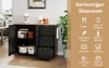 A black kitchen cart with a wooden top is shown in a kitchen setting. The cart has open doors revealing storage and drawers. A plant is to the right, and a text overlay lists storage possibilities. Voir les images du produit