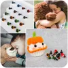 A collage of images showing craft safety eyes and noses, a child hugging a teddy bear, a baby sleeping with a teddy bear, and a crocheted cupcake with safety eyes. Náhled obrázku produktu
