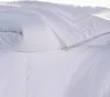 A close-up view of a white comforter or duvet. Produktbild-Vorschau