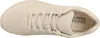 A top-down view of a beige sneaker. Voir les images du produit