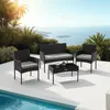 A rattan garden furniture set by a swimming pool with a sea view. Náhled obrázku produktu