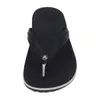 A top-down view of a black Crocs flip-flop on a white background. Produktbild-Vorschau