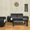 A modern living room with a black sofa, armchair, and coffee table. Náhled obrázku produktu