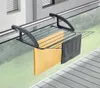 A balcony drying rack with towels hanging on it, attached to a railing. Produktbild-Vorschau