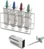 A set of four stainless steel ice pop molds in a stand, with individual accessory pieces shown below. Produktbild-Vorschau