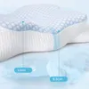 A close-up, cross-section view of an ergonomic pillow, highlighting its layered construction and dimensions. Produktbild-Vorschau