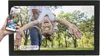 A digital photo frame displaying a family photo, with a smartphone in hand showing a gallery of photos. Náhľad obrázku produktu