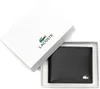 A black Lacoste wallet is presented in its white branded box. Voir les images du produit