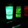 Several tubes of glow-in-the-dark acrylic paint are displayed in a dark setting, with some tubes glowing brightly. Náhľad obrázku produktu