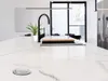 A close-up view of a modern kitchen island with a sink and faucet. Náhľad obrázku produktu