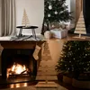 A collage of four images showing different Christmas tree decorations and settings. Podgląd zdjęcia produktu