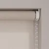 Close-up of a beige roller blind mechanism and fabric. Produktbild-Vorschau