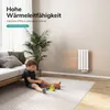 A child is playing on the floor in a living room with a radiator on the wall. Produktbild-Vorschau