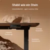 A close-up of a desk with a rock and a glass of water, highlighting its stability. Produktbild-Vorschau