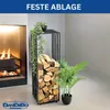 A metal firewood rack filled with logs next to a fireplace, with plants. Produktbild-Vorschau