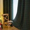 A chair with Christmas decorations in front of plaid curtains. Podgląd zdjęcia produktu