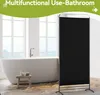 A modern bathroom with a freestanding bathtub and a black room divider. Náhľad obrázku produktu