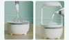 Two images showing a white humidifier being filled with water from a bottle. The left image shows a bowl-shaped humidifier, and the right image shows a taller, more enclosed humidifier. Náhled obrázku produktu
