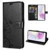 A collage of images showing a black flip phone case with a floral design, a phone inside the case, and the case open to show card slots. Produktbild-Vorschau