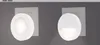 Two white circular lights are mounted on a gray wall, each plugged into a white wall socket. Voir les images du produit