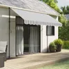 A striped awning extends over a sliding glass door on the side of a house, with a wooden deck in the foreground and potted plants nearby. Produktbild-Vorschau