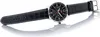 A men's Casio watch with a black leather strap and a black dial is displayed on a white reflective surface. Anteprima dell’immagine prodotto