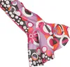 A close-up of a flared sleeve with a colorful retro pattern. Produktbild-Vorschau