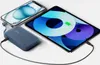 A blue Belkin power bank is charging a tablet and a smartphone. Produktbild-Vorschau