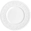 A white ceramic plate with an embossed decorative rim. Podgląd zdjęcia produktu
