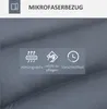 Close-up of a gray fabric with icons and text describing product features. Náhled obrázku produktu