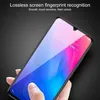 A hand is holding a smartphone with a screen protector, demonstrating fingerprint recognition. Produktbild-Vorschau