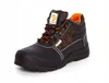 A black work boot with orange accents and laces, shown against a white background. Produktbild-Vorschau