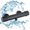 A black shower faucet with water splashing around it. Podgląd zdjęcia produktu