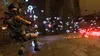 A person in a sci-fi suit is in combat with multiple alien creatures and projectiles in a rocky, alien environment. Produktbild-Vorschau