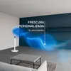 A white standing fan is shown in a modern living room setting, with abstract blue waves emanating from it to illustrate airflow and personalized cooling. Voir les images du produit