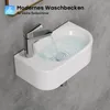 A modern, wall-mounted sink with water flowing from the faucet. Produktbild-Vorschau