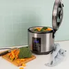 A digital rice cooker and steamer with vegetables (carrots and broccoli) being prepared on a cutting board next to it. Náhľad obrázku produktu