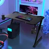 A gaming desk setup with a computer, monitor, keyboard, and headphones, illuminated by ambient lighting. Anteprima dell’immagine prodotto