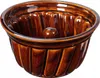 A brown ceramic gugelhupf baking mold. Voir les images du produit