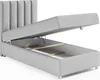 A light gray upholstered bed frame with the mattress lifted to reveal the storage compartment underneath. Produktbild-Vorschau