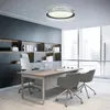 A modern office setting with a desk, chairs, and a large window. Náhled obrázku produktu