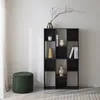 A black bookshelf with various decorative items and books, next to a green ottoman, in a room with a white wall and a curtain. Anteprima dell’immagine prodotto